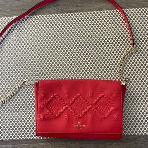 Has some discoloration with the katespade name in the front